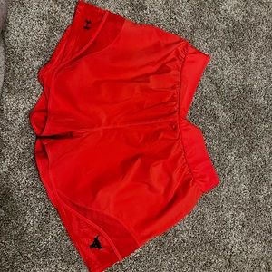 Project Rock pink/orange shorts with pockets